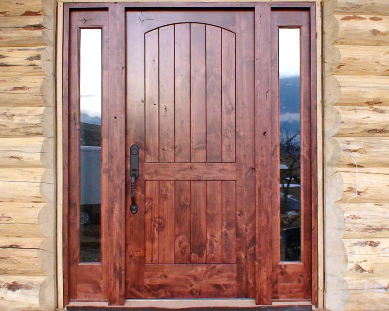 Knotty alder plank style panels with an arch top rail.