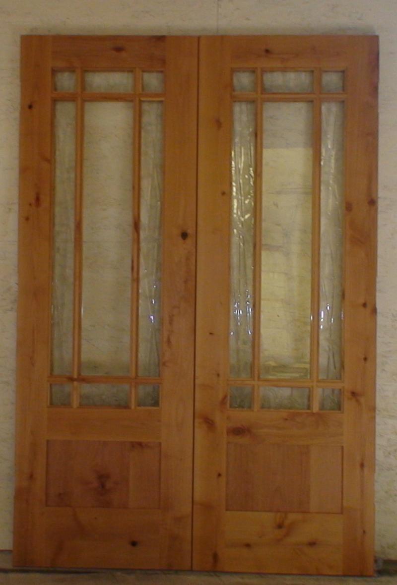 Custom knotty alder double doors with art glass.