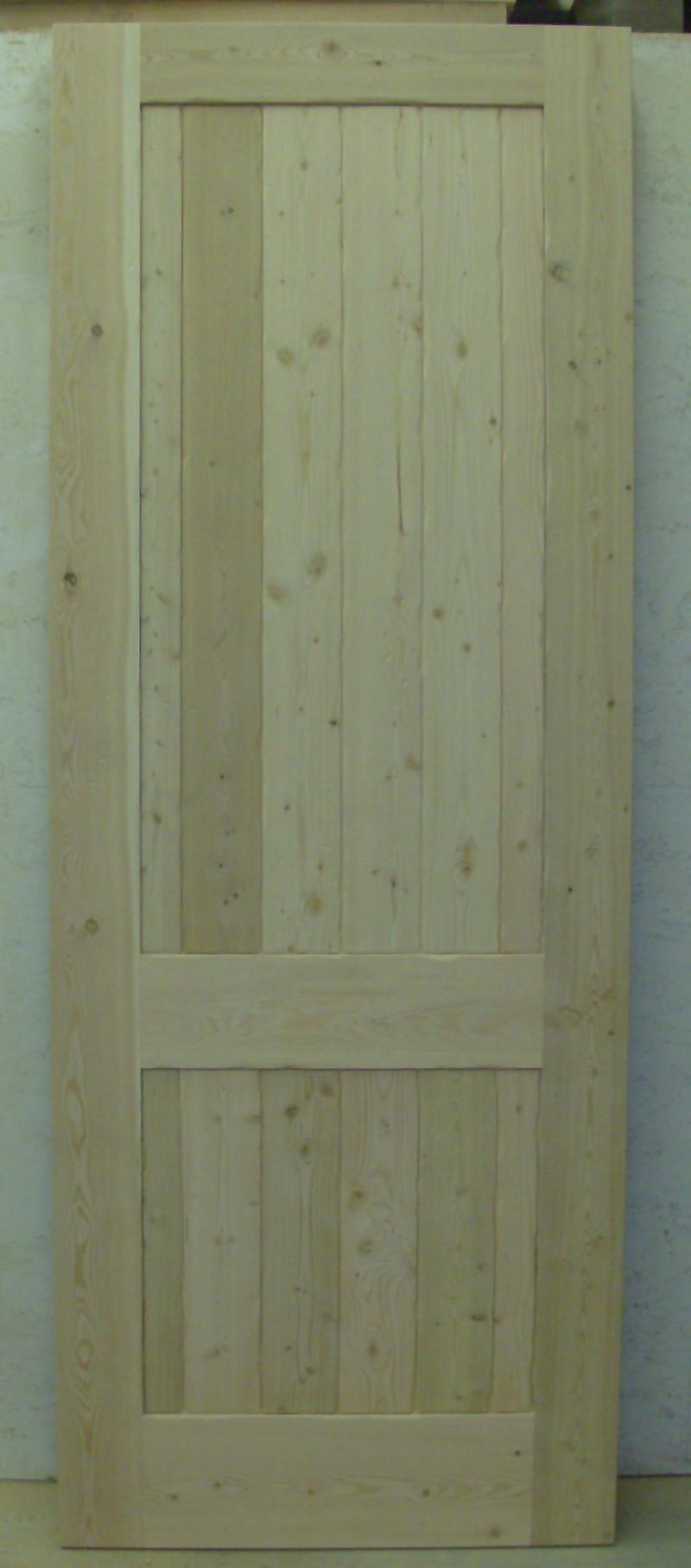 Fir two panel plank style door with medium distress.